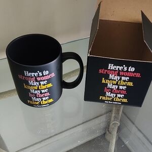 Glossy Black Ceramic Mug with Vibrant Typography